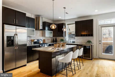 a bedroom with a bed and a night stand