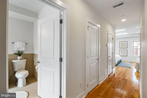a view of hallway with white doors