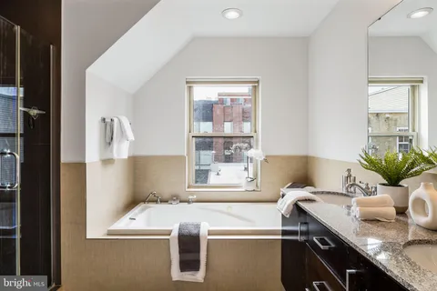a bathroom with a shower and a toilet
