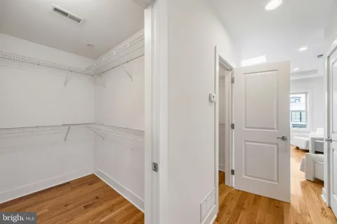 a backyard of a house with table and sofas