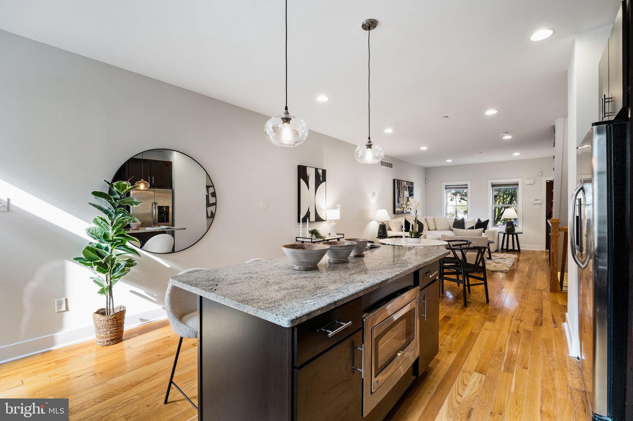 2140 Carpenter Street Philadelphia, PA 19146 - Photo 9 of 41 a kitchen with a table and chairs