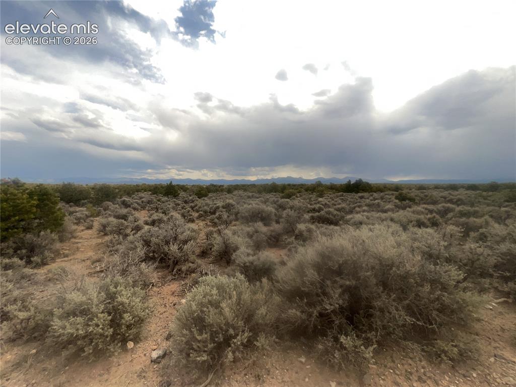 Lot 8 Melby Ranch Road San Luis, CO 81152 - Photo 9 of 20 Expansive undeveloped land featuring natural desert vegetation, distant mountains, and a clear horizon