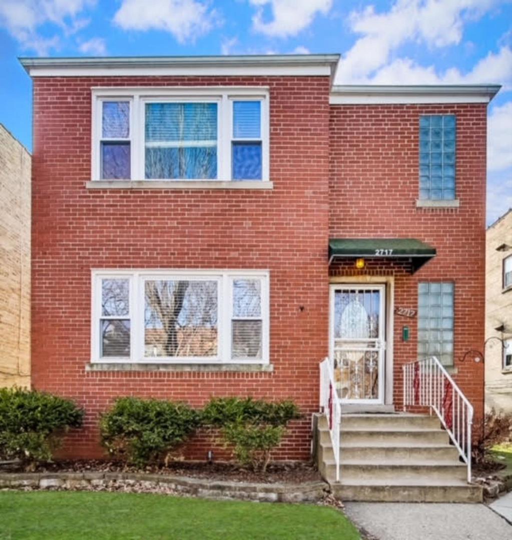 2717 West Rascher Avenue Chicago, IL 60625 - Photo 1 of 37 a front view of a house with garden