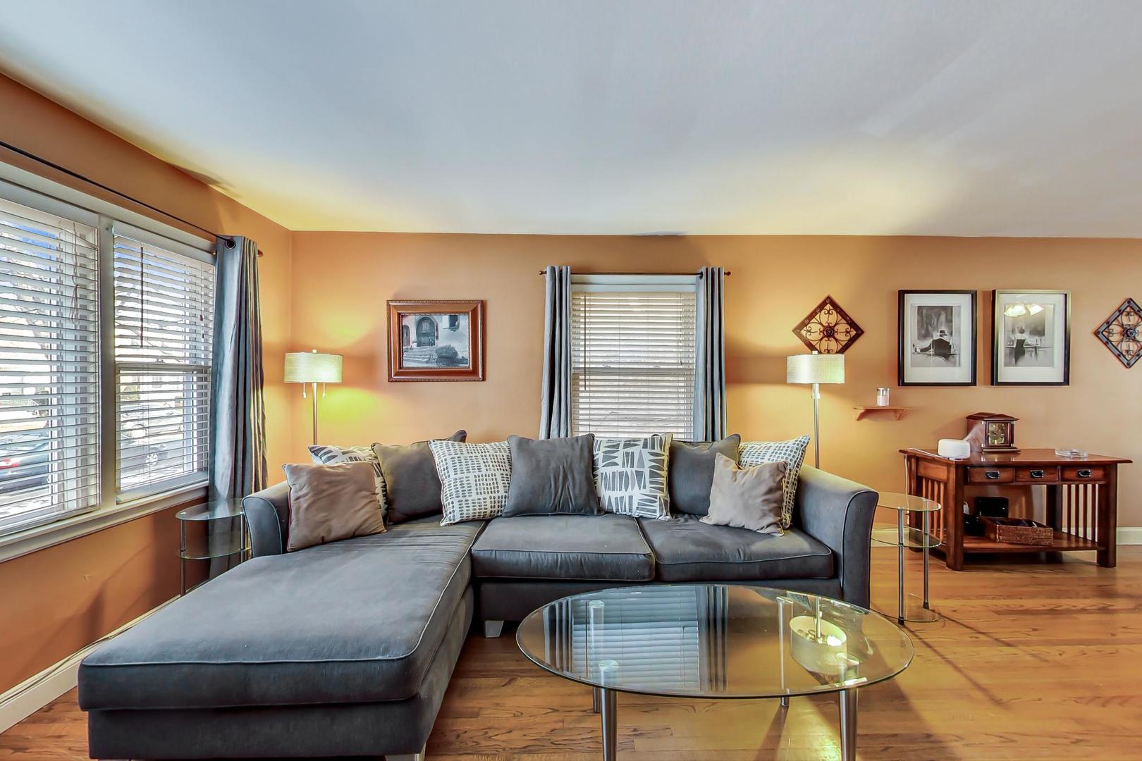 2717 West Rascher Avenue Chicago, IL 60625 - Photo 2 of 37 a living room with furniture and a large window