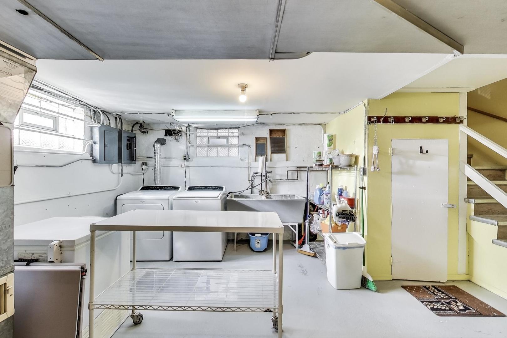 2717 West Rascher Avenue Chicago, IL 60625 - Photo 19 of 37 a kitchen with a sink appliances and cabinets
