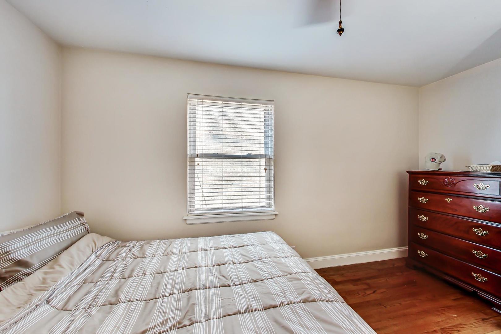 2717 West Rascher Avenue Chicago, IL 60625 - Photo 27 of 37 a bedroom with a bed and a window