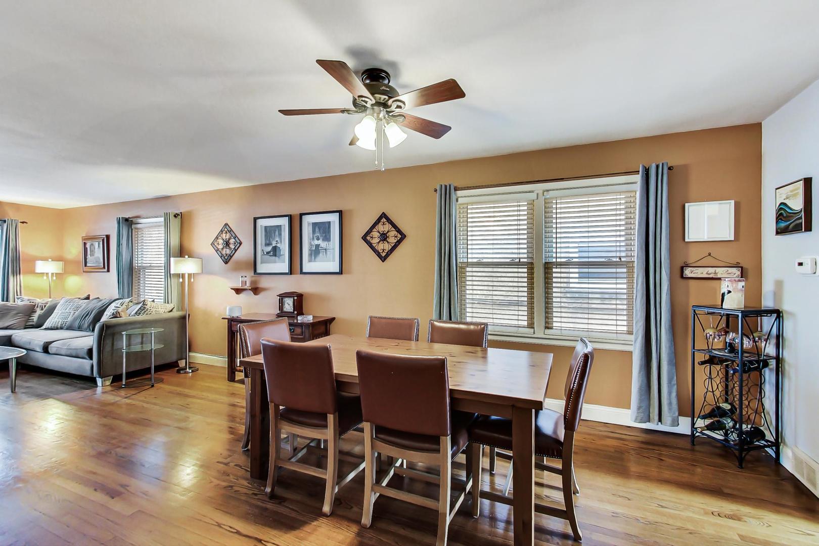 2717 West Rascher Avenue Chicago, IL 60625 - Photo 4 of 37 a view of a dining room with furniture window and wooden floor