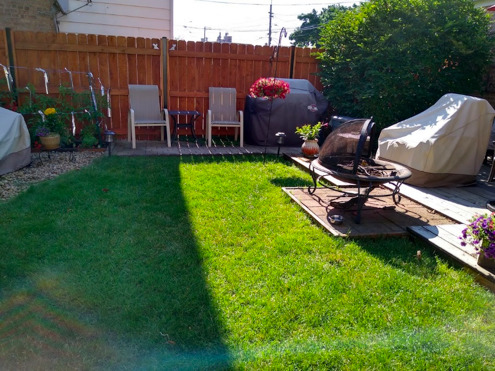 2717 West Rascher Avenue Chicago, IL 60625 - Photo 32 of 37 a backyard of a house with table and chairs