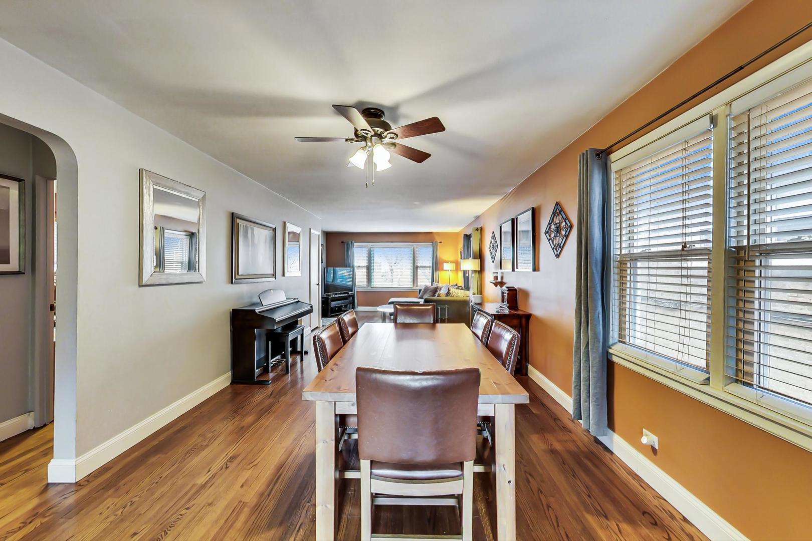 2717 West Rascher Avenue Chicago, IL 60625 - Photo 5 of 37 a view of a dining room with furniture window and wooden floor