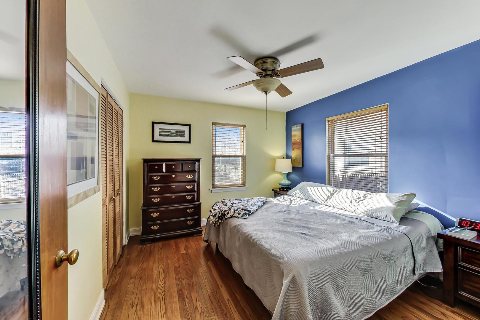 2717 West Rascher Avenue Chicago, IL 60625 - Photo 9 of 37 a bed sitting in a spacious bedroom next to a window