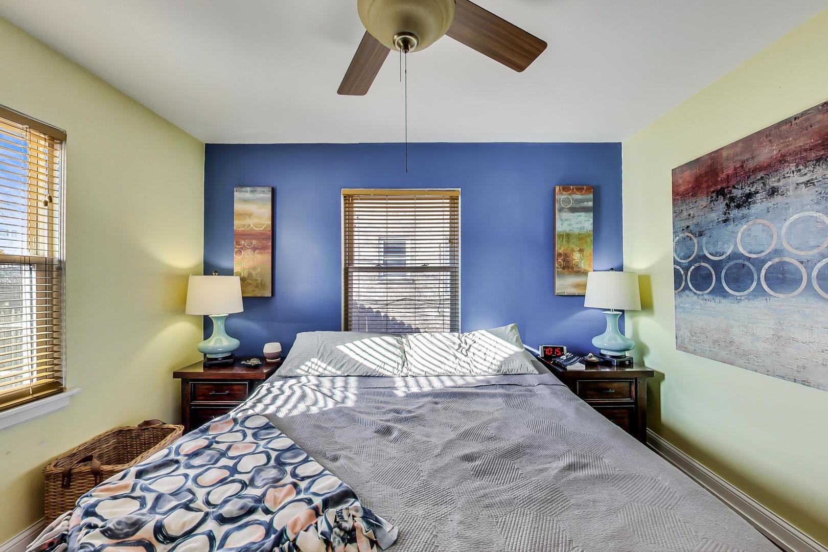 2717 West Rascher Avenue Chicago, IL 60625 - Photo 10 of 37 a bedroom with a bed and a chandelier