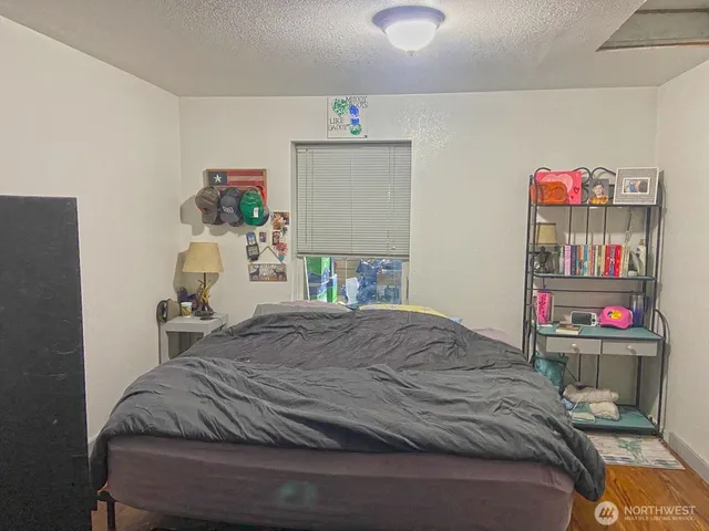 a bedroom with a bed and closet