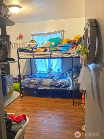 a bed room with furniture and a lamp