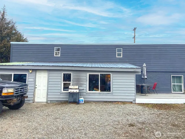 a front view of a house with parking space
