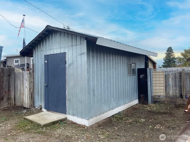 a wooden door in front of a house
