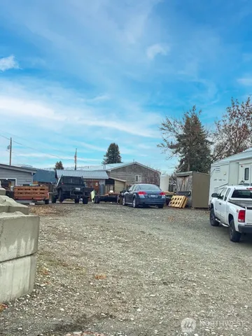 a view of outdoor space with deck and car parked
