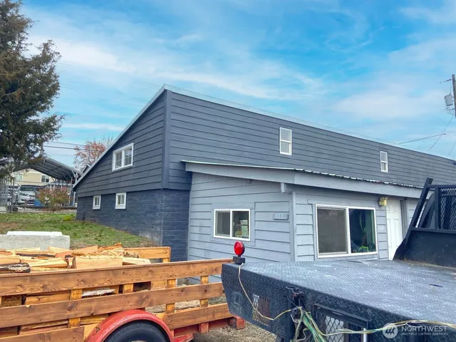 a backyard of a house with seating space