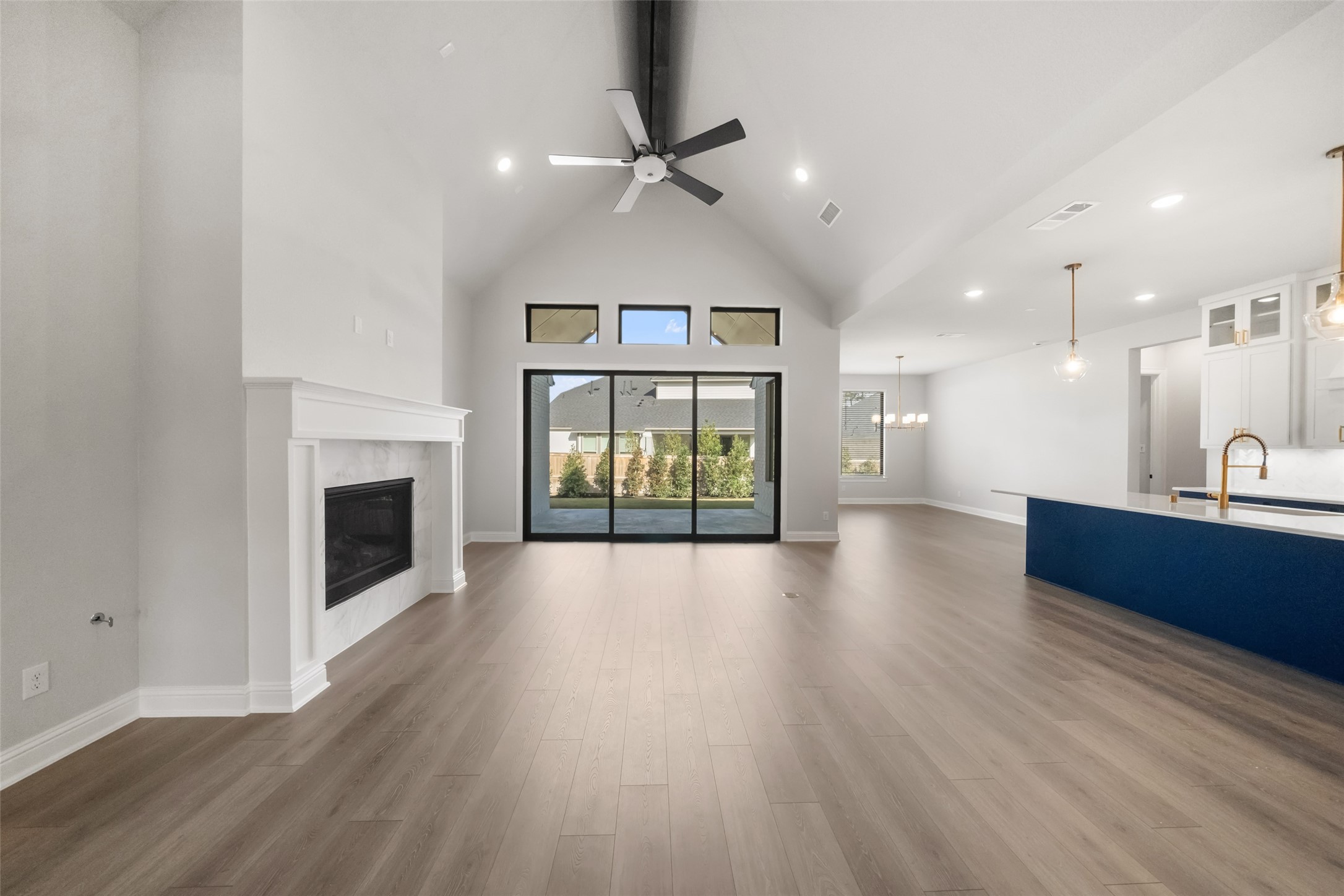 15464 Ringbill Way Magnolia, TX 77354 - Photo 6 of 37 a view of an empty room with a fireplace and a window