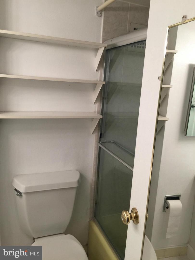 950 25th Street Northwest, Unit 310N Washington, DC 20037 - Photo 6 of 29 a bathroom with a toilet and a shower