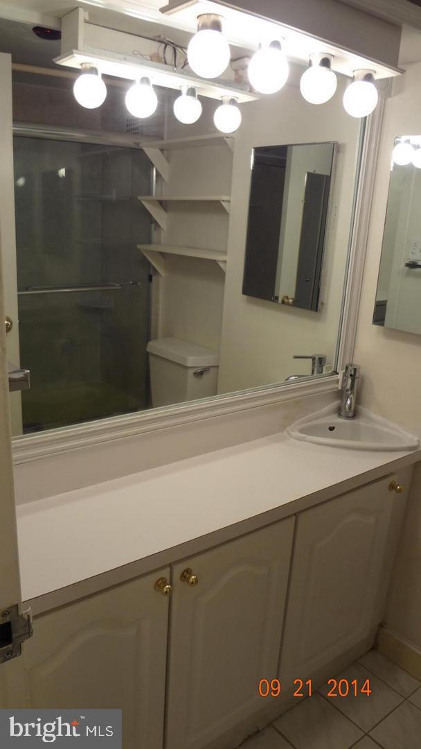 950 25th Street Northwest, Unit 310N Washington, DC 20037 - Photo 7 of 29 a bathroom with a sink and a mirror