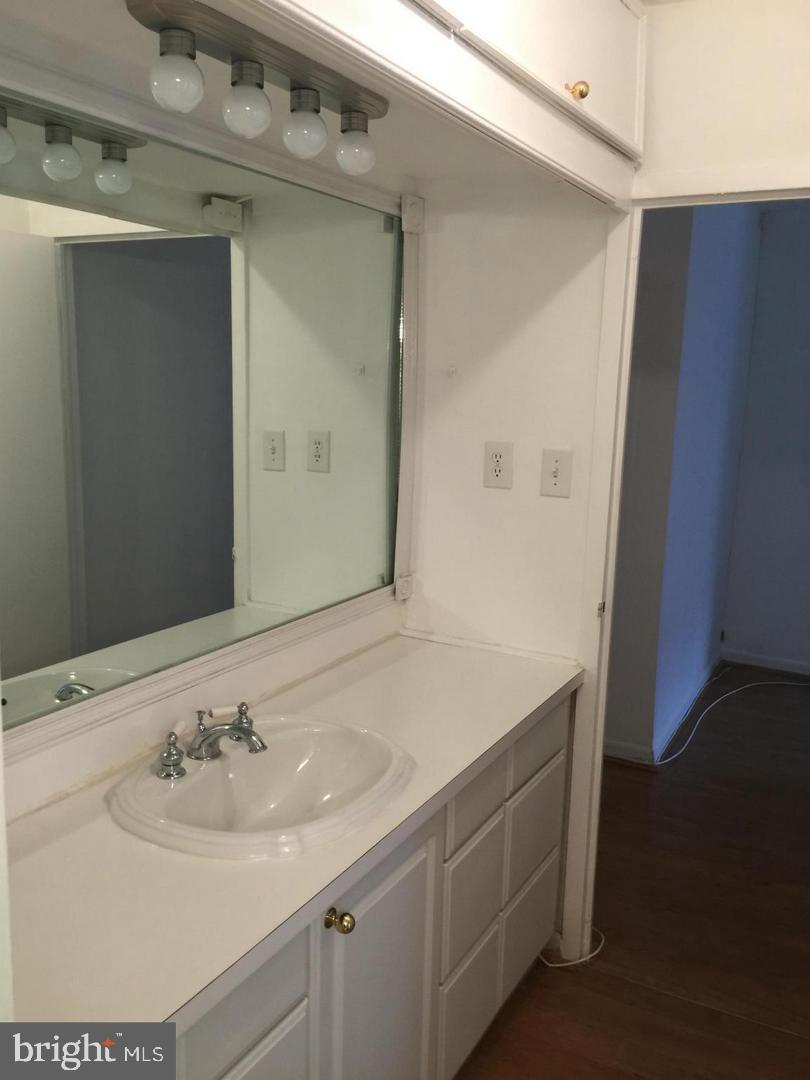 950 25th Street Northwest, Unit 310N Washington, DC 20037 - Photo 9 of 29 a bathroom with a sink and a mirror
