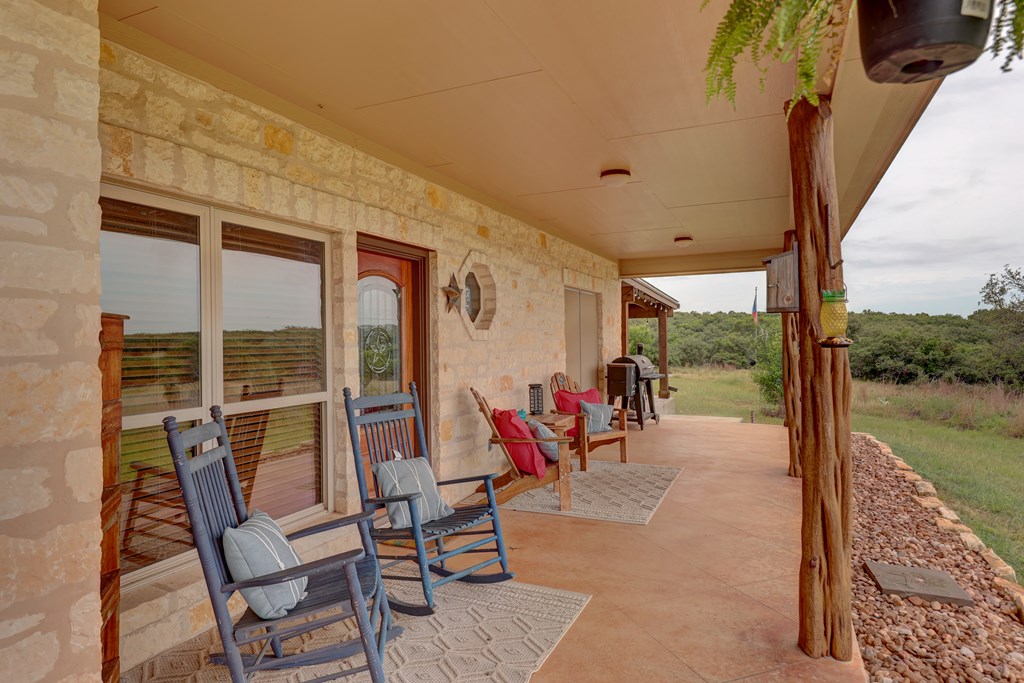 8177 Wendel Road Harper, TX 78631 - Photo 5 of 32 a view of a patio with a table chairs and backyard