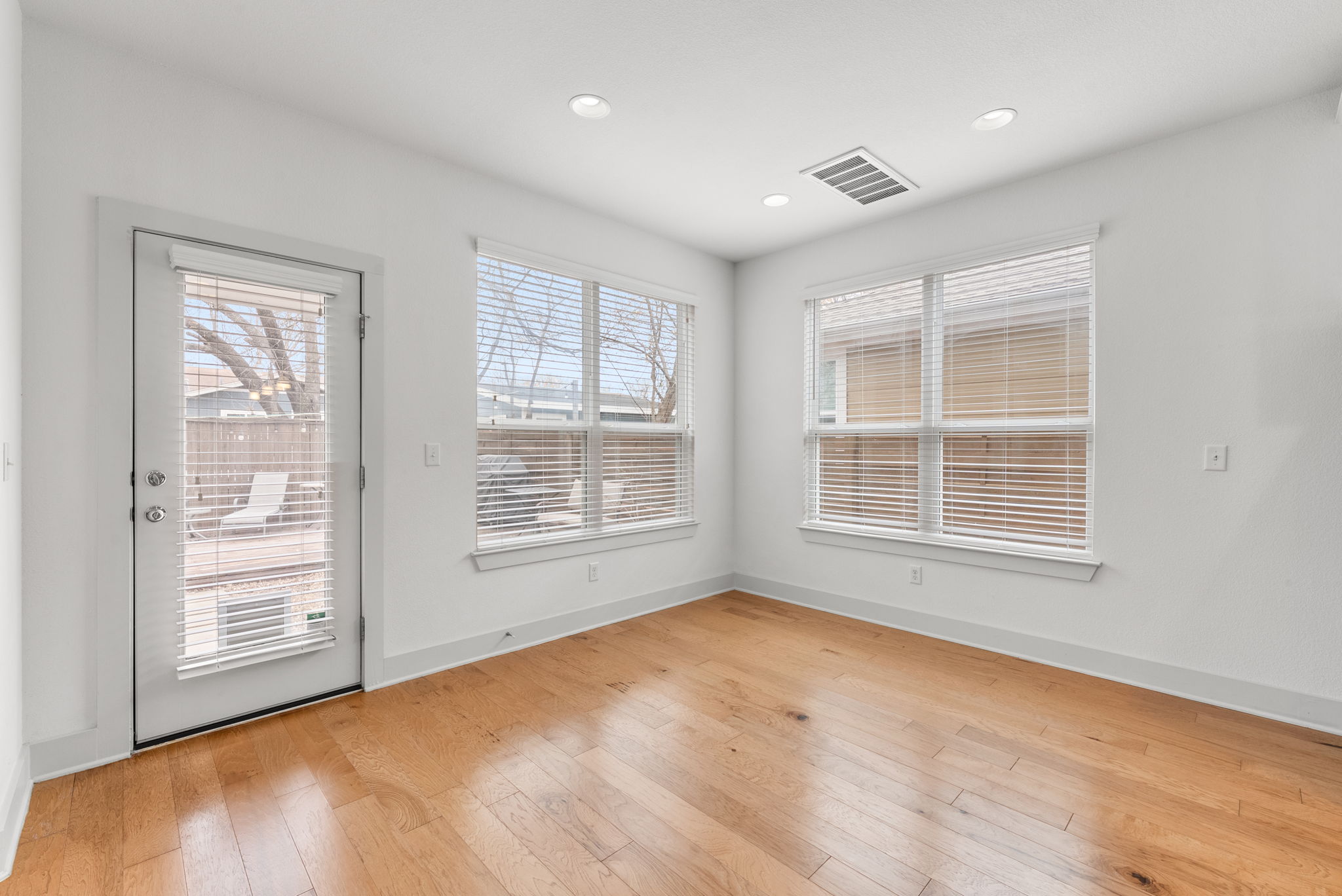 1501 Homespun Road Austin, TX 78745 - Photo 16 of 33 Spare room with light wood finished floors and recessed lighting