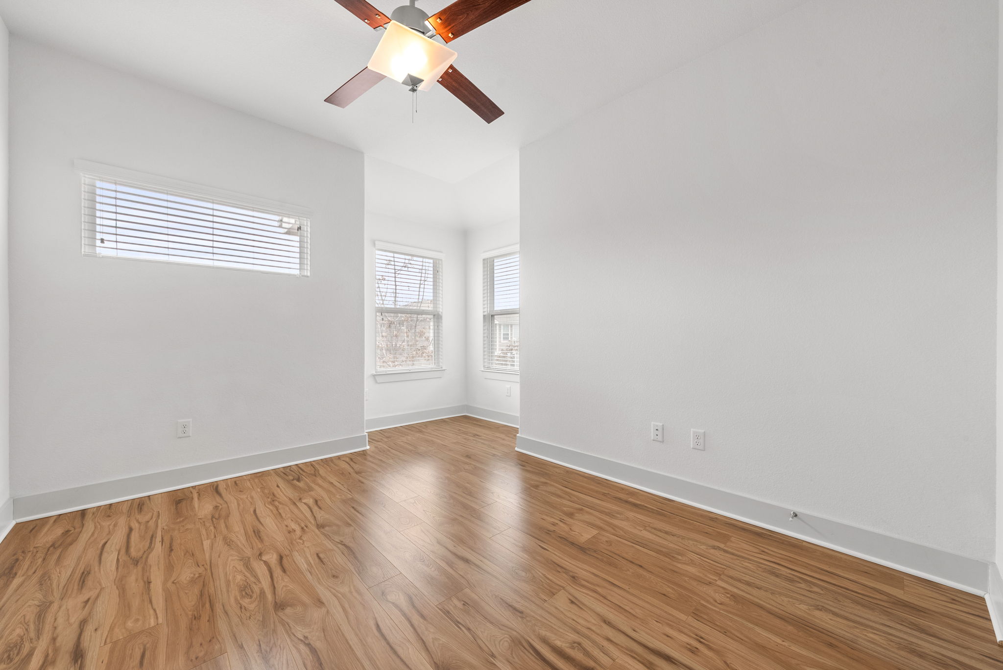 1501 Homespun Road Austin, TX 78745 - Photo 22 of 33 Spare room featuring wood finished floors and a ceiling fan