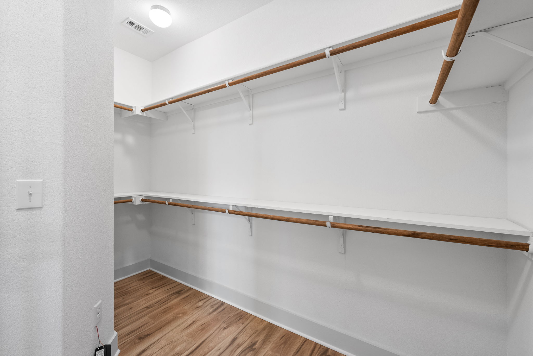 1501 Homespun Road Austin, TX 78745 - Photo 23 of 33 Walk in closet with light wood-style flooring