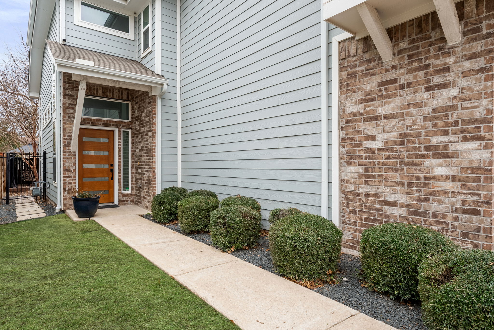 1501 Homespun Road Austin, TX 78745 - Photo 9 of 33 View of exterior entry featuring a gate and brick siding