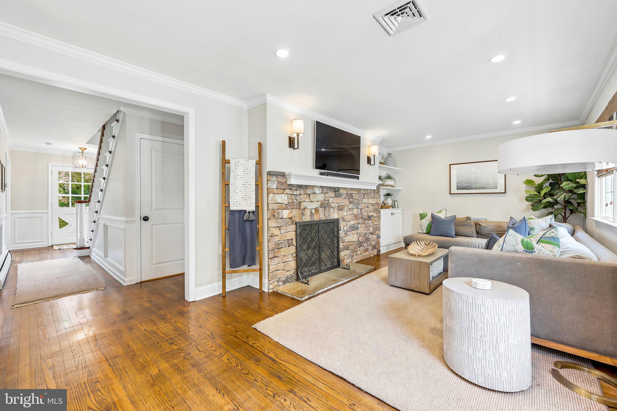 566 Upper Weadley Road Wayne, PA 19087 - Photo 20 of 50 Family Room w/ fireplace and custom builtins
