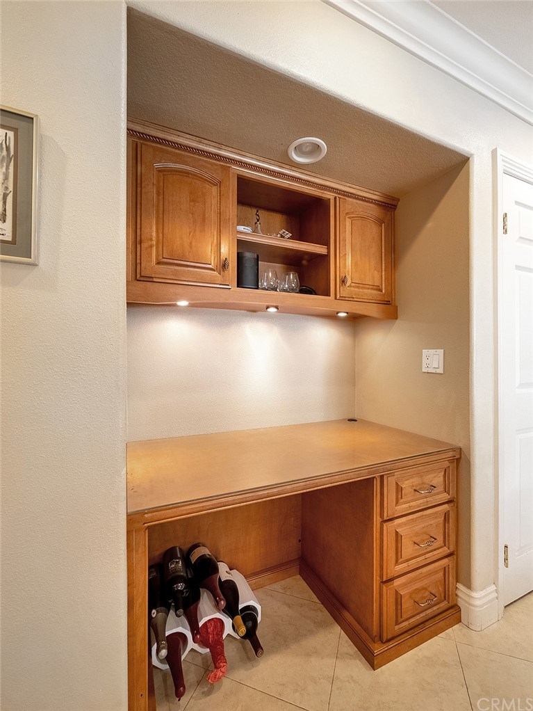 878 Prospect Place Costa Mesa, CA 92626 - Photo 22 of 47 Built-in office desk with custom cabinets and drawers and tile floors