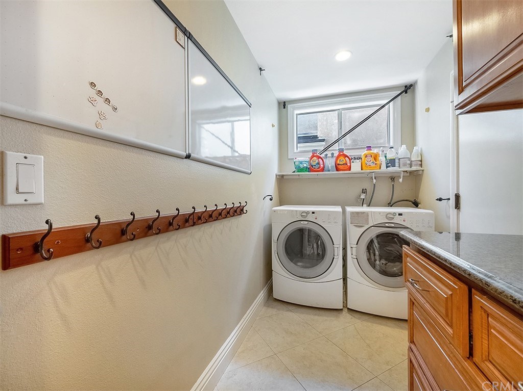 878 Prospect Place Costa Mesa, CA 92626 - Photo 23 of 47 Individual Laundry room, washer and dryer included, custom cabinets and granite counter tops