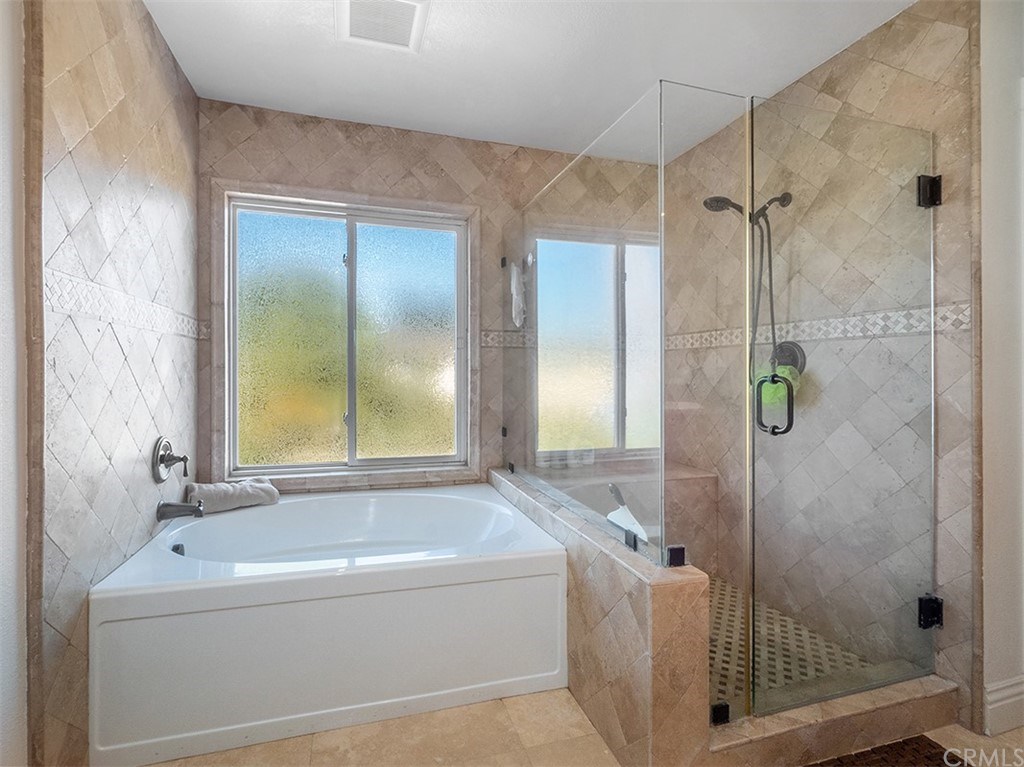 878 Prospect Place Costa Mesa, CA 92626 - Photo 35 of 47 Master bathroom has both a soaking tub and a stand in shower