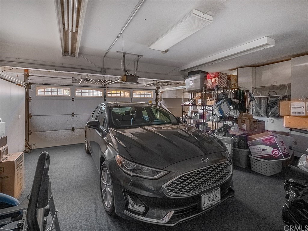 878 Prospect Place Costa Mesa, CA 92626 - Photo 41 of 47 Two car garage, carpeted with built in cabinets