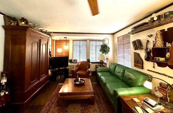 a living room with furniture rug and window