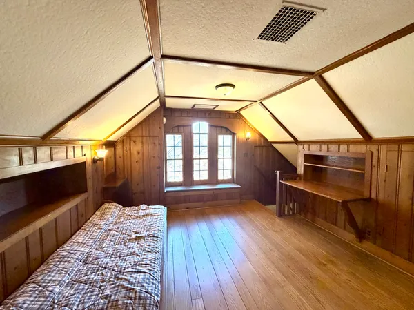 a view of an entryway with wooden floor