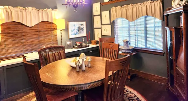 a kitchen with a sink a stove and cabinets