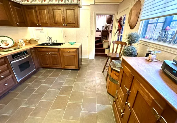 a kitchen with a refrigerator and a stove