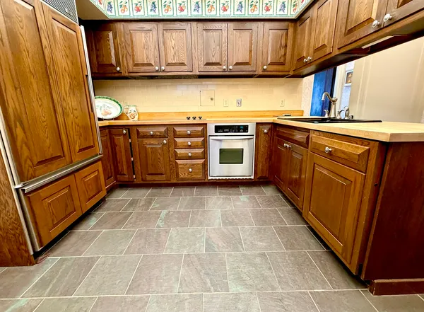 a kitchen with a cabinets and steel appliances