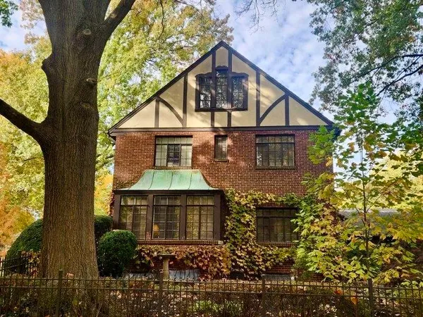 front view of a house with a small yard