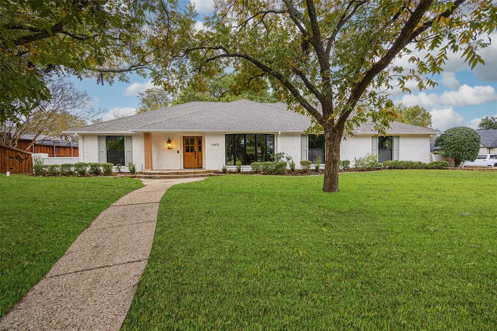 16805 Deer Park Drive Dallas, TX 75248 - Photo 1 of 39 a front view of house with yard and green space