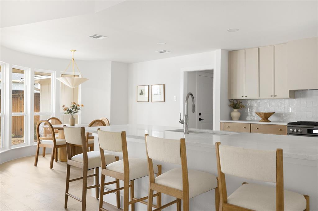 16805 Deer Park Drive Dallas, TX 75248 - Photo 11 of 39 a large kitchen with a table and chairs