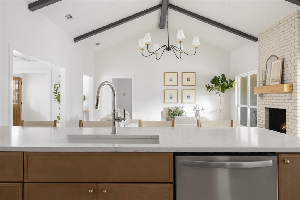 16805 Deer Park Drive Dallas, TX 75248 - Photo 13 of 39 a kitchen with a sink and a chandelier