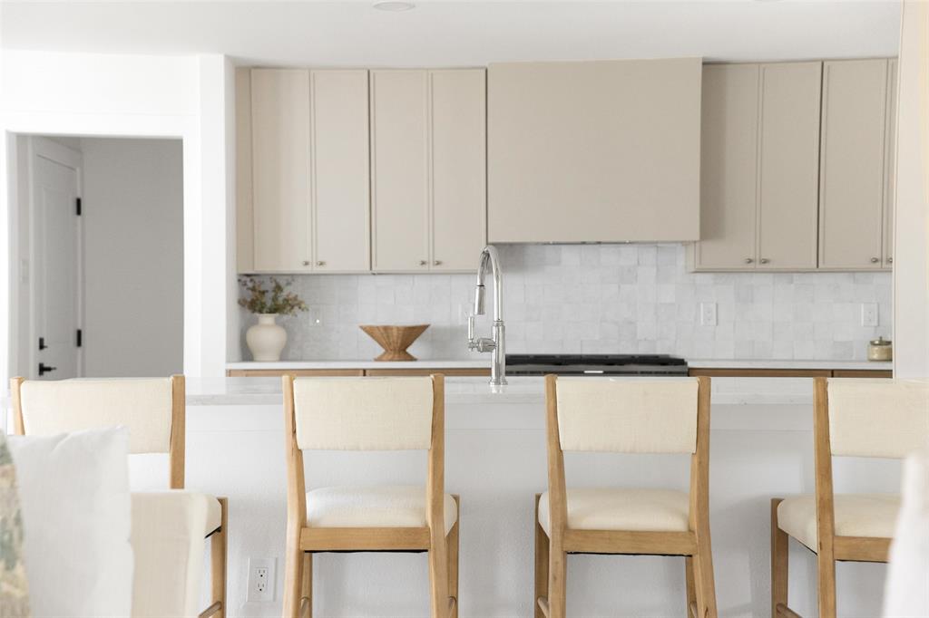 16805 Deer Park Drive Dallas, TX 75248 - Photo 15 of 39 a kitchen with a refrigerator and white cabinets