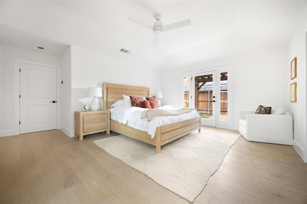 16805 Deer Park Drive Dallas, TX 75248 - Photo 21 of 39 a bedroom with a bed and a couch