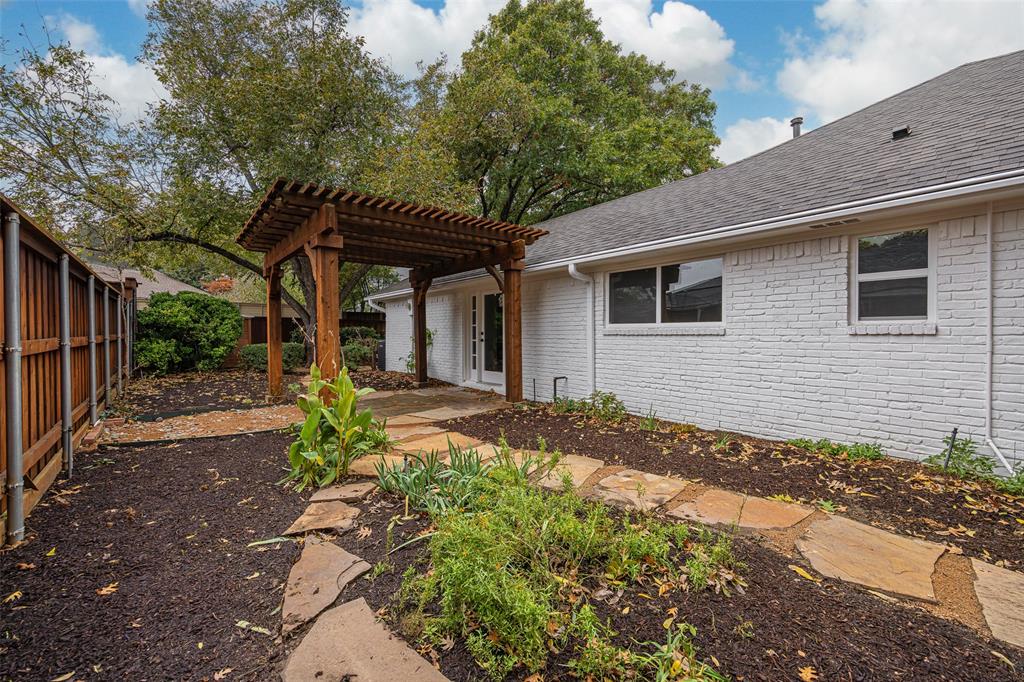 16805 Deer Park Drive Dallas, TX 75248 - Photo 23 of 39 a front view of house with yard and trees around