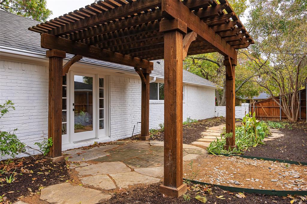 16805 Deer Park Drive Dallas, TX 75248 - Photo 24 of 39 a front view of a house with garden