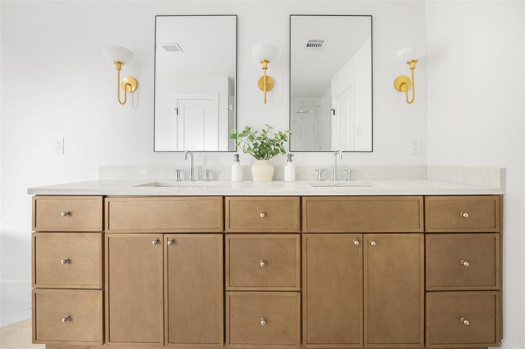 16805 Deer Park Drive Dallas, TX 75248 - Photo 26 of 39 a bathroom with a granite countertop sink a mirror and a shower