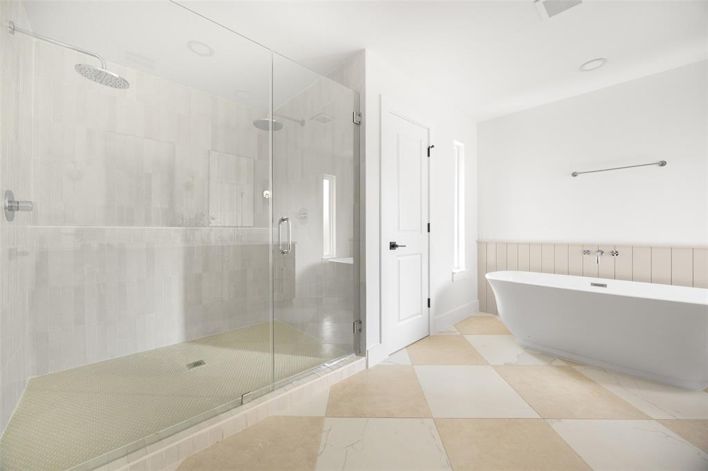 16805 Deer Park Drive Dallas, TX 75248 - Photo 27 of 39 a bathroom with a bathtub and shower